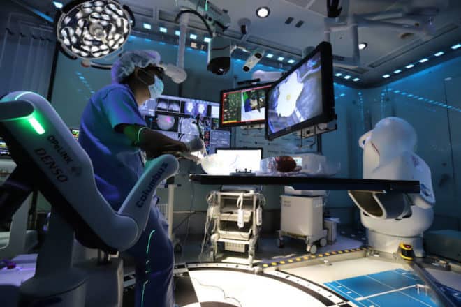 July 9, 2018, Tokyo, Japan - A brain surgeon checks monitors and demonstrates the prototype model of the smart surgery room "Super Cyber operating Theater (SCOT)" at a laboratory of the Tokyo Women's Medical University (TWMU) in Tokyo on Monday, July 9, 2018. TWMU, Shinshu University and Japanese electriocs companies such as Denso and Hitachi developed the smart surgery room where all electronics devices such as MRI, operating microscope, electrosurgical knife and communication devices are linked by Denso's OPeLINK system. (Photo by Yoshio Tsunoda/AFLO)