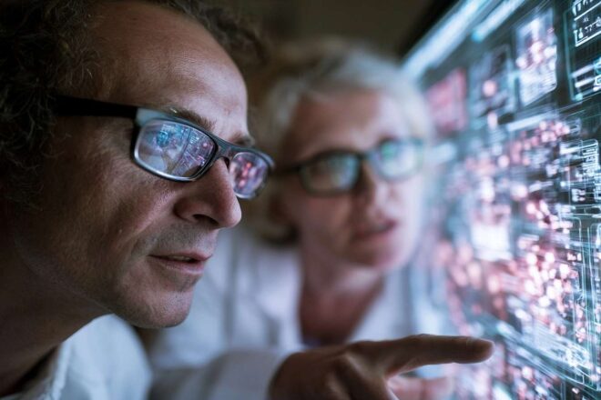 Researchers analyzing data holographic interface healthcare collaboration innovation
