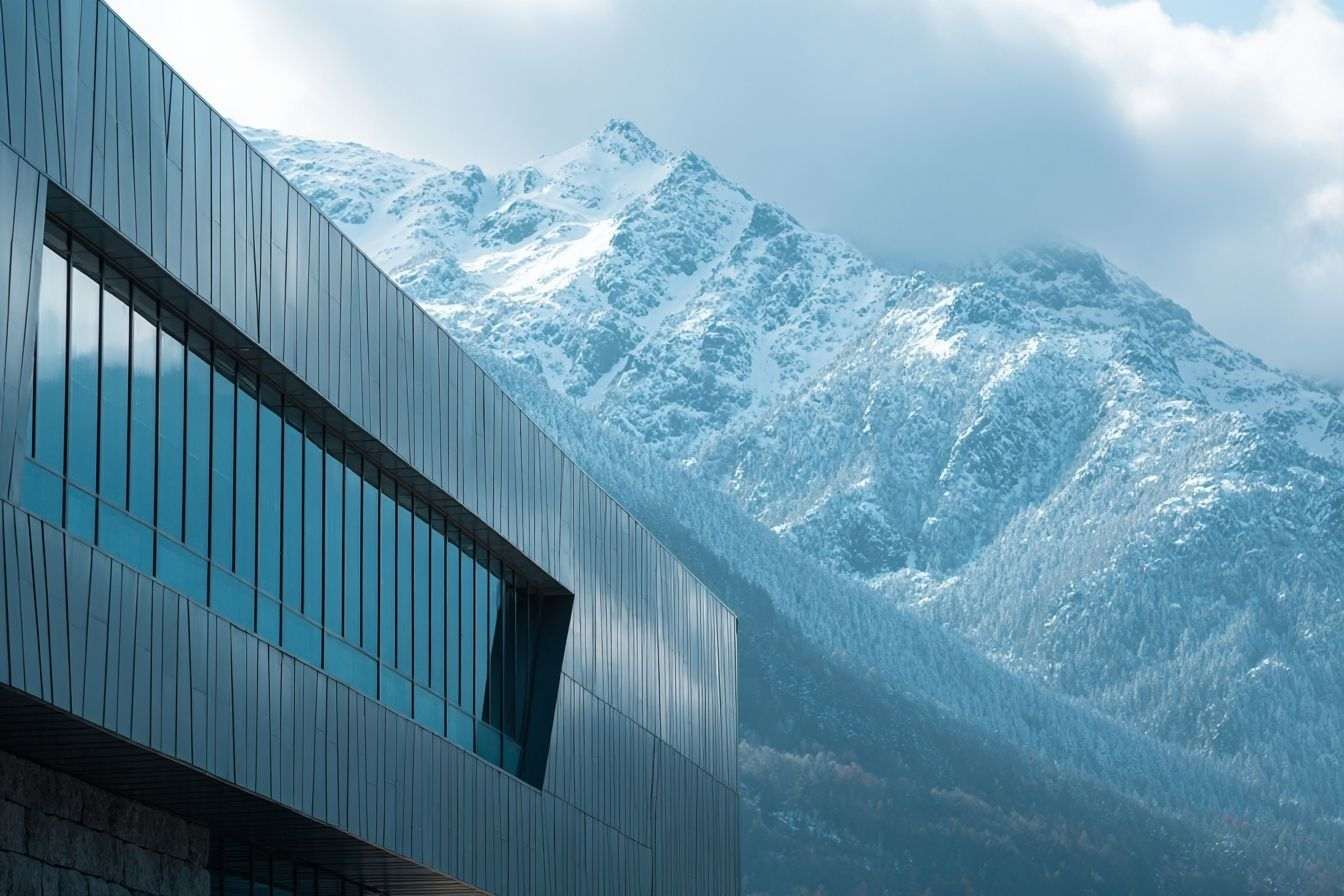 Éclairage cinématographique bâtiment moderne paysage alpin